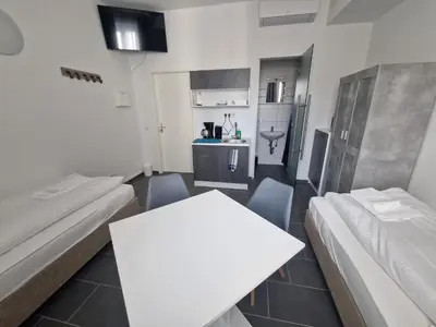 Ein Bett oder Betten in einem Zimmer der Unterkunft BusinessQuartier Berlin