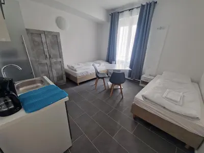 Ein Bett oder Betten in einem Zimmer der Unterkunft BusinessQuartier Berlin