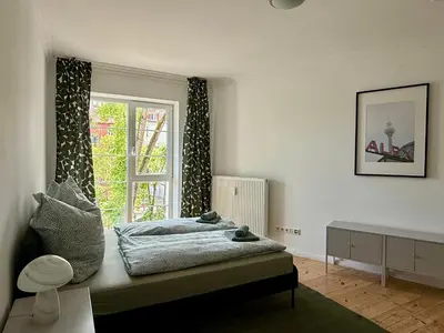 Ein Bett oder Betten in einem Zimmer der Unterkunft DeNe Living Apartments