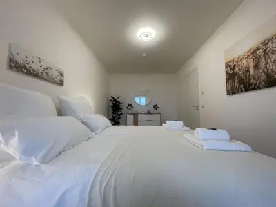 Ein Bett oder Betten in einem Zimmer der Unterkunft Luxurious and stylish apartment at BER Airport