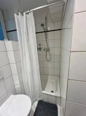 Ein Badezimmer in der Unterkunft 3 Personen Apartment im Zentrum