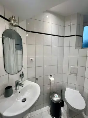 Ein Badezimmer in der Unterkunft 3 Personen Apartment im Zentrum