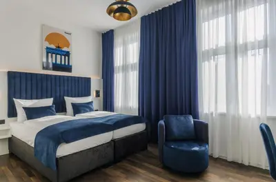 Ein Bett oder Betten in einem Zimmer der Unterkunft Homaris East Side - Self-Check In