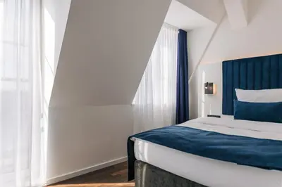 Ein Bett oder Betten in einem Zimmer der Unterkunft Homaris East Side - Self-Check In