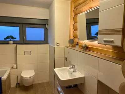 Ein Badezimmer in der Unterkunft Blockhausvermietung Himmelpfort
