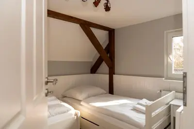 Ein Bett oder Betten in einem Zimmer der Unterkunft LANDHAUS by Comfort Housing - up to 7 guests