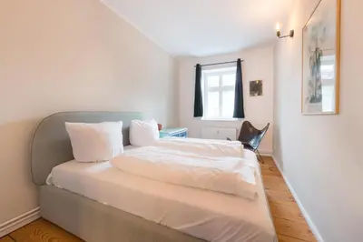 Ein Bett oder Betten in einem Zimmer der Unterkunft Design Apartments - Sanssouci, 10 Geschwister-Scholl-Straße
