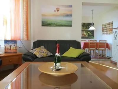 Ein Sitzbereich in der Unterkunft Holiday apartment Seagull