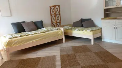 Ein Bett oder Betten in einem Zimmer der Unterkunft Kräuter-Heidi Garten
