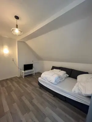 Ein Bett oder Betten in einem Zimmer der Unterkunft King David Garden