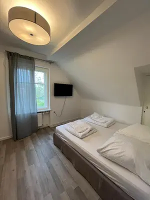Ein Bett oder Betten in einem Zimmer der Unterkunft King David Garden