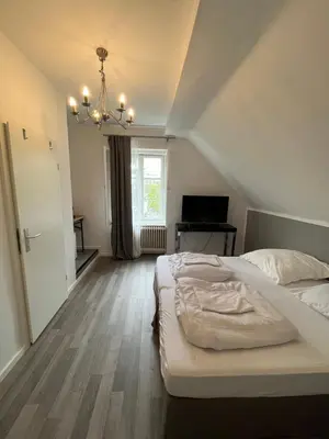 Ein Bett oder Betten in einem Zimmer der Unterkunft King David Garden