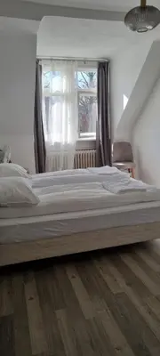 Ein Bett oder Betten in einem Zimmer der Unterkunft King David Garden