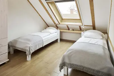 Ein Bett oder Betten in einem Zimmer der Unterkunft Fliederhaus
