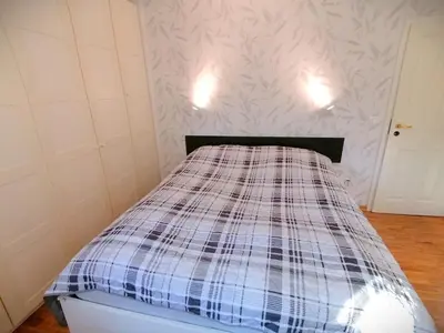 Ein Bett oder Betten in einem Zimmer der Unterkunft Lovely central flat with grand piano, family friendly