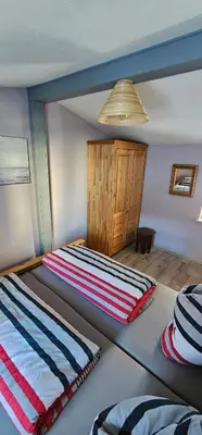 Ein Bett oder Betten in einem Zimmer der Unterkunft Ferienhaus in der historischen Altstadt von Angermünde
