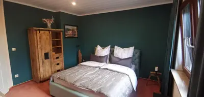 Ein Bett oder Betten in einem Zimmer der Unterkunft Chill Haus mit Sauna und Kamin