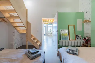 Ein Bett oder Betten in einem Zimmer der Unterkunft Architektur Wohnung in Mitte - Brunnenstr