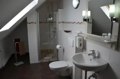 Ein Badezimmer in der Unterkunft SkyPension