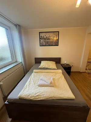 Ein Bett oder Betten in einem Zimmer der Unterkunft SkyPension
