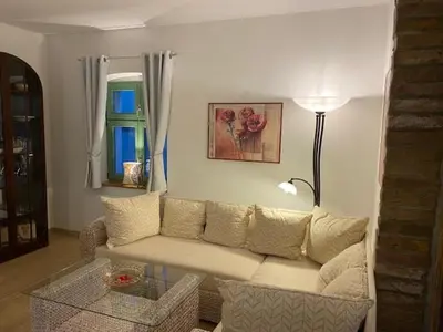 Ein Sitzbereich in der Unterkunft Eisern Home 1