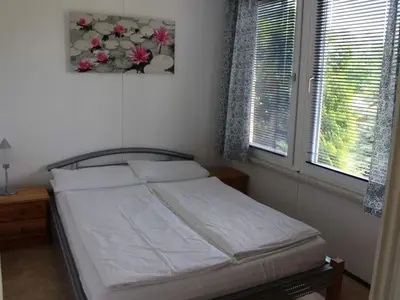 Ein Bett oder Betten in einem Zimmer der Unterkunft Bungalow Oberspreewald 3
