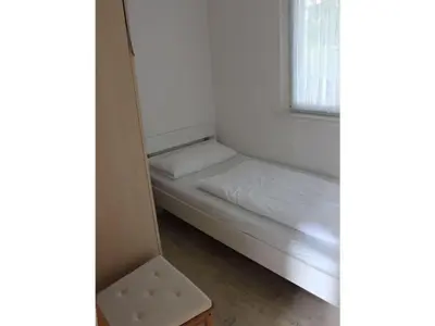 Ein Bett oder Betten in einem Zimmer der Unterkunft Bungalow Oberspreewald 5