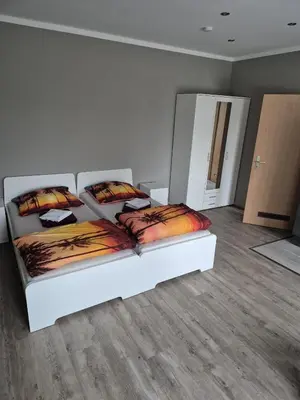 Ein Bett oder Betten in einem Zimmer der Unterkunft Gästehaus Eiche
