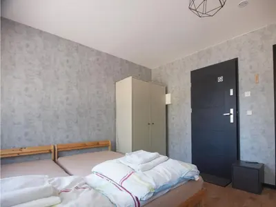 Ein Bett oder Betten in einem Zimmer der Unterkunft Gästehaus Eiche