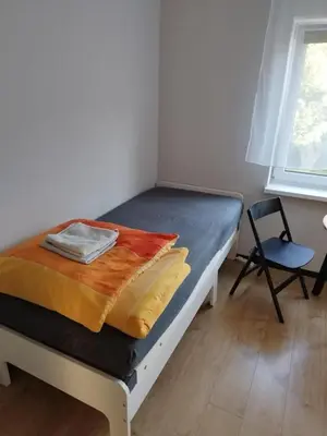 Ein Bett oder Betten in einem Zimmer der Unterkunft Gästehaus Eiche