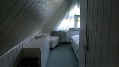 Ein Bett oder Betten in einem Zimmer der Unterkunft Ferienhaus Rose & Lavendel