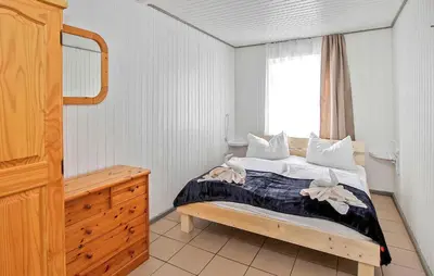 Ein Bett oder Betten in einem Zimmer der Unterkunft Fh Orange