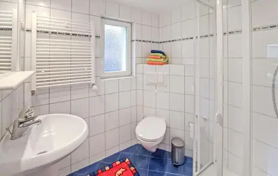 Ein Badezimmer in der Unterkunft Ferienhaus Röddelin