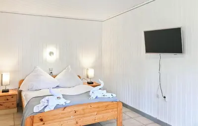 Ein Bett oder Betten in einem Zimmer der Unterkunft Fh Lila