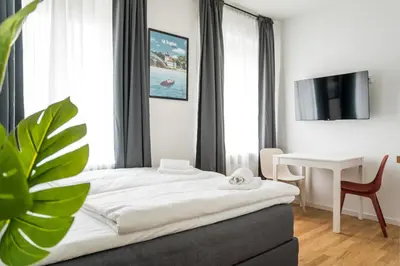 Ein Bett oder Betten in einem Zimmer der Unterkunft Homaris Apartments Schlüterstraße