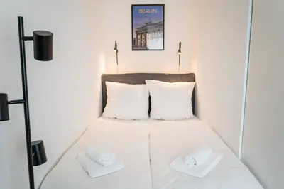 Ein Bett oder Betten in einem Zimmer der Unterkunft Homaris Apartments Schlüterstraße