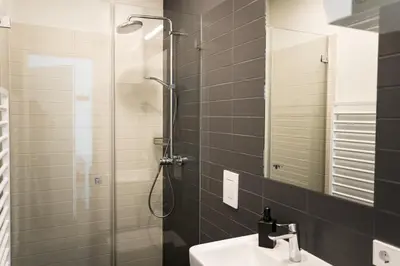 Ein Badezimmer in der Unterkunft Homaris Apartments Schlüterstraße