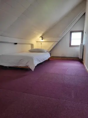 Ein Bett oder Betten in einem Zimmer der Unterkunft Alte Schule Brodowin