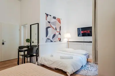 Ein Bett oder Betten in einem Zimmer der Unterkunft Prenzlauer Pearl Luxury Suite