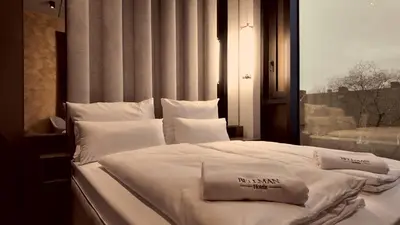 Ein Bett oder Betten in einem Zimmer der Unterkunft Bellman Hotel