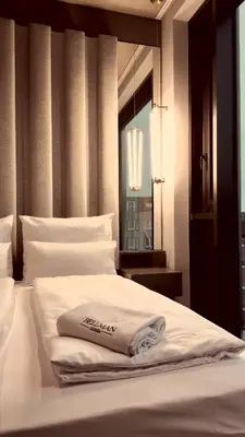 Ein Bett oder Betten in einem Zimmer der Unterkunft Bellman Hotel
