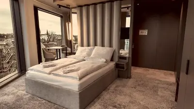Ein Bett oder Betten in einem Zimmer der Unterkunft Bellman Hotel