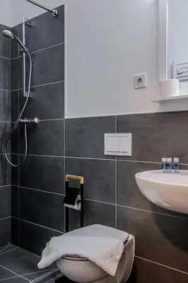 Ein Badezimmer in der Unterkunft Queens Residenz