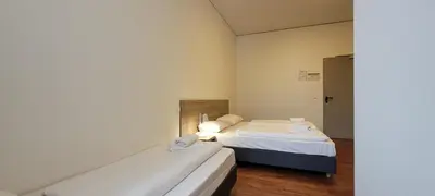 Ein Bett oder Betten in einem Zimmer der Unterkunft Queens Residenz