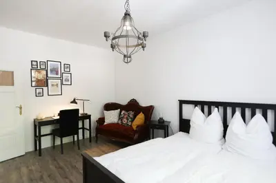 Ein Bett oder Betten in einem Zimmer der Unterkunft Kl. Fontane Ferienwohnung Bad Freienwalde direkt am Markt