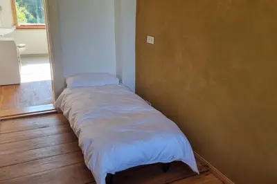 Ein Bett oder Betten in einem Zimmer der Unterkunft Wohnung in der Waldstadt