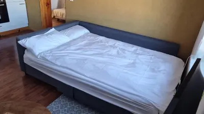 Ein Bett oder Betten in einem Zimmer der Unterkunft Wohnung in der Waldstadt