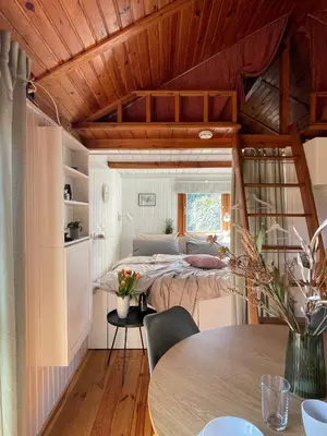 Ein Bett oder Betten in einem Zimmer der Unterkunft Tiny House mit Garten in See-Nähe