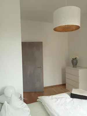 Ein Bett oder Betten in einem Zimmer der Unterkunft Stadtgrün 1, Ruhiges Apartment mit Terrasse und kostenlosem Parkplatz, ideal für Berlin-Besucher