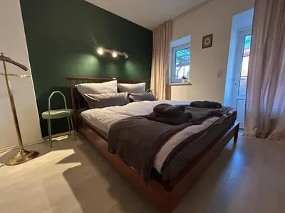 Ein Bett oder Betten in einem Zimmer der Unterkunft Gemütliche Wohnung Landlust in See-Nähe